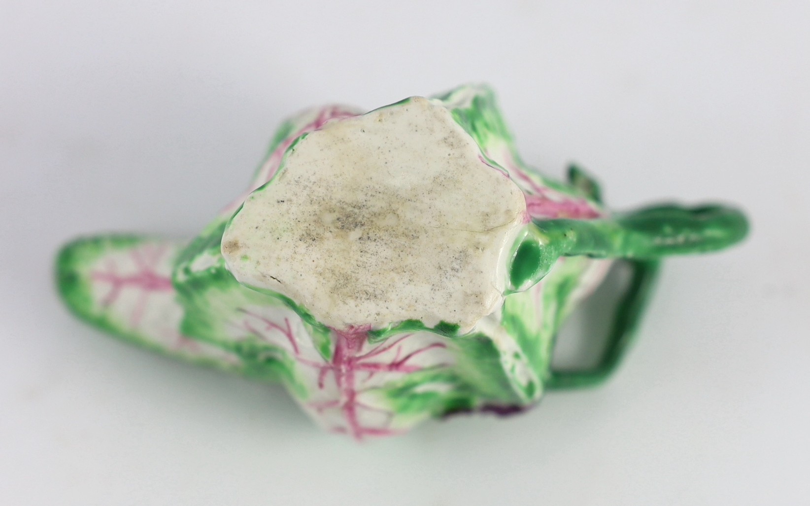 A Longton Hall cream jug, c.1755, 12.5cm long 8.1 cm high, hairline cracks